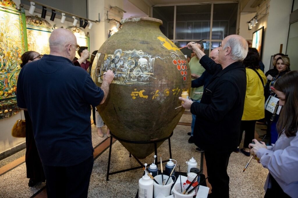 Sergo Tbileli, Mamuka Mikeladze and other artists painting Qvevri on The Rooted in Culture event